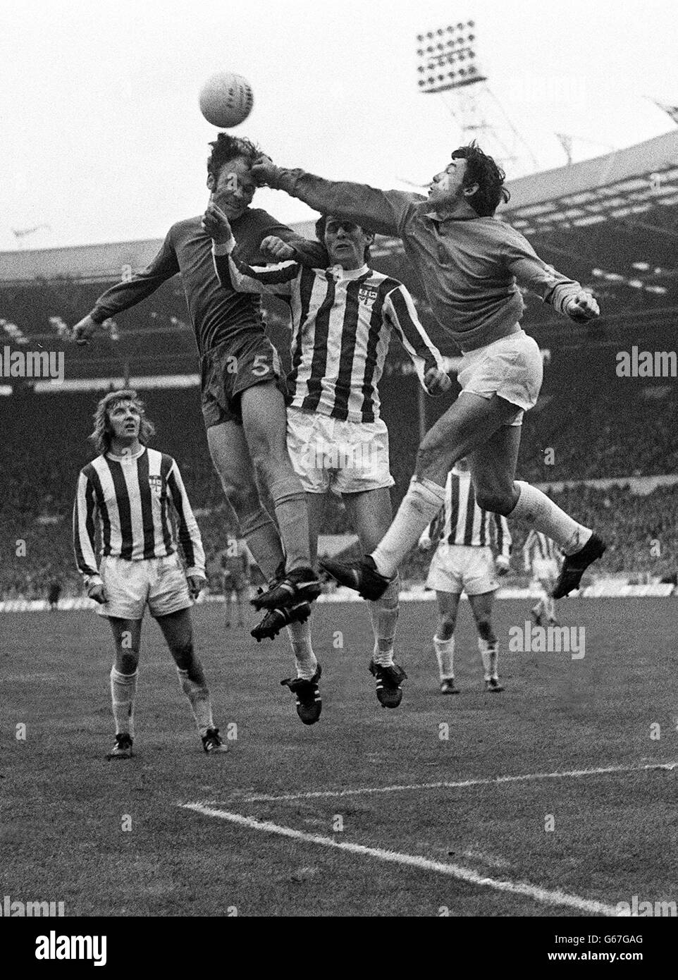 Stoke City goalkeeper Gordon Banks seems to be shooting a straight right to the head as he fists the ball away from Chelsea No. 5 John Dempsey in the Football League Cup Final - won by Stoke 2-1 - at Wembley Stadium. Stock Photo