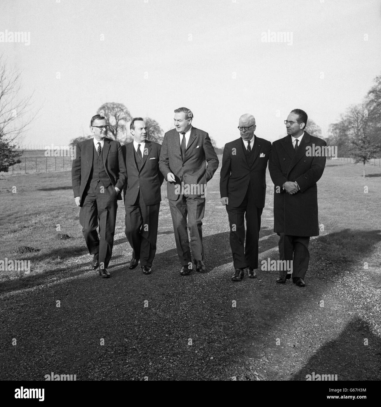 Finance ministers from five nations stroll through the gardens at Chequers, where they met to discuss the international interaction of their respective economic policies. (l-r) Professor Karl Schiller from Germany, Michel Debre from France, Britain's James Callaghan, Henry Fowler from the United States and Emilio Colombo from Italy. 22/01/1967 Stock Photo