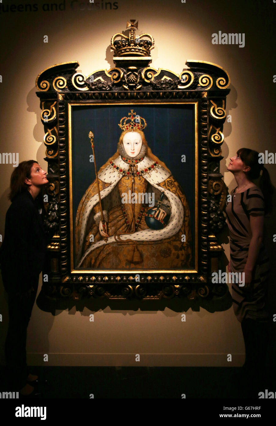 Staff members at the National Museum of Scotland in Edinburgh with one of the exhibits in the Mary Queen of Scots exhibition, the image show is of Queen Elizabeth I, looking back at her life, which runs from 28th June until 27th November 2013. Stock Photo