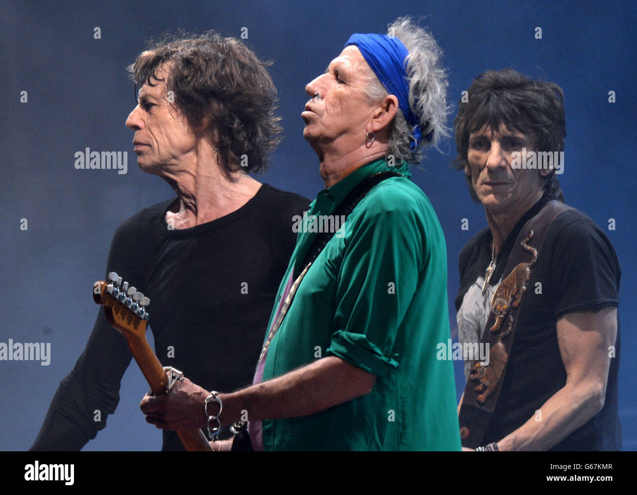 (left to right) Mick Jagger, Keith Richards and Ronnie Wood from the Rolling Stones perform on the Pyramid Stage during the Glastonbury 2013 Festival of Contemporary Performing Arts at Pilton Farm, Somerset. Stock Photo