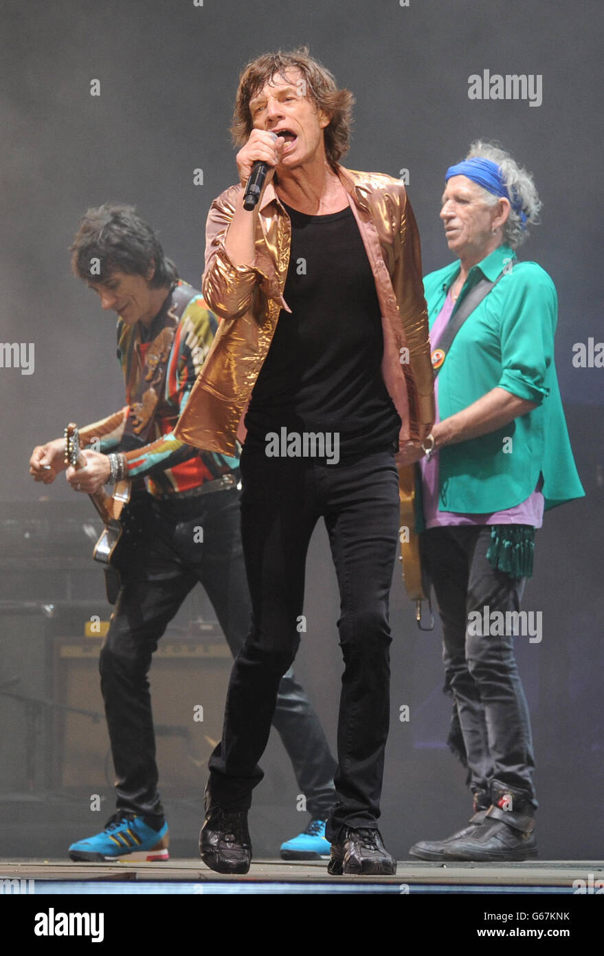 Mick Jagger (centre), Keith Richards (right) and Ronnie Wood (left), of the Rolling Stones, perform on the Pyramid Stage during the Glastonbury 2013 Festival at Pilton Farm, Somerset. Stock Photo