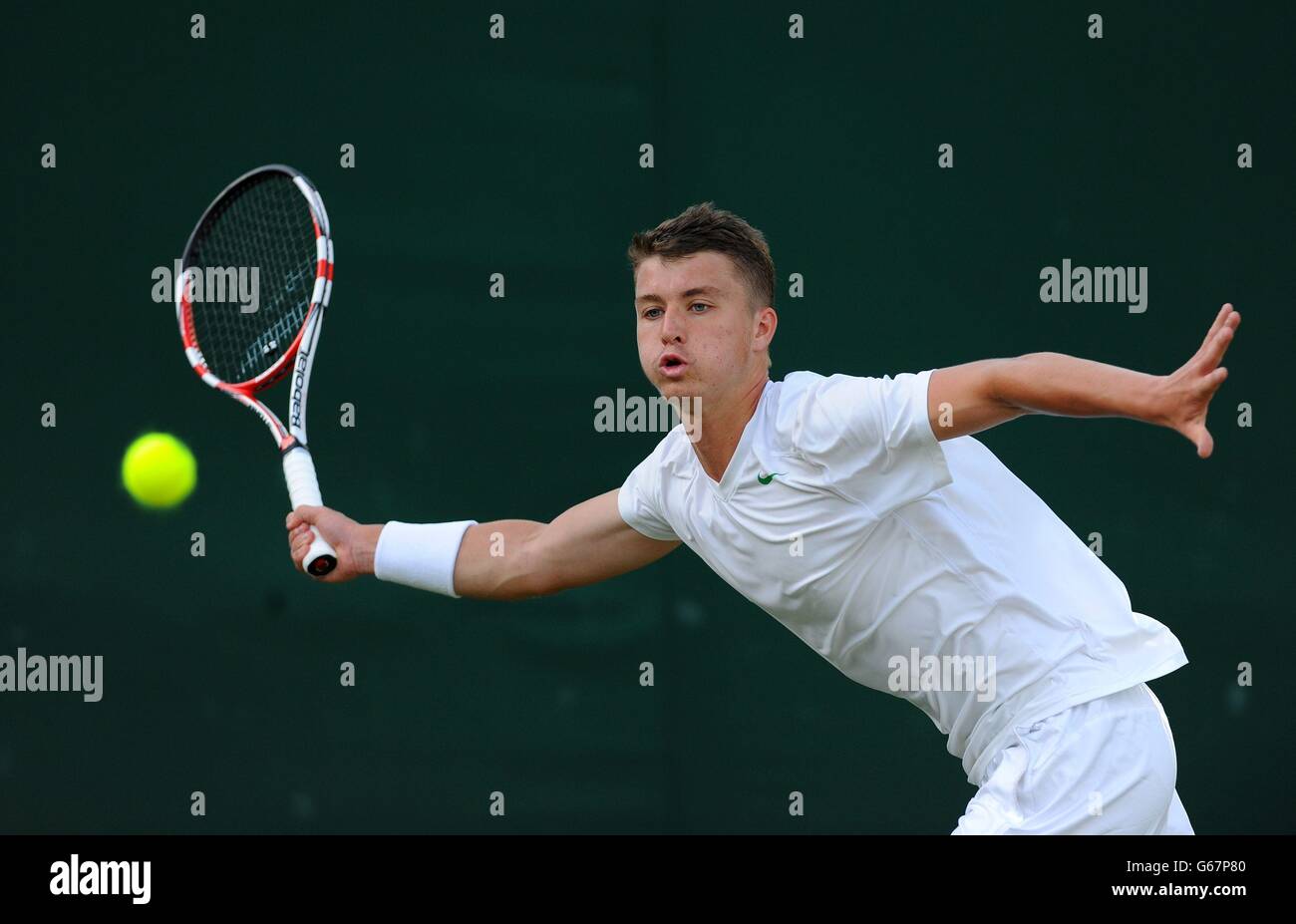 Great Britain's Jonny O'Mara in action against France's Maxime Janvier in his Boy's Singles match during day seven of the Wimbledon Championships at The All England Lawn Tennis and Croquet Club, Wimbledon. Stock Photo