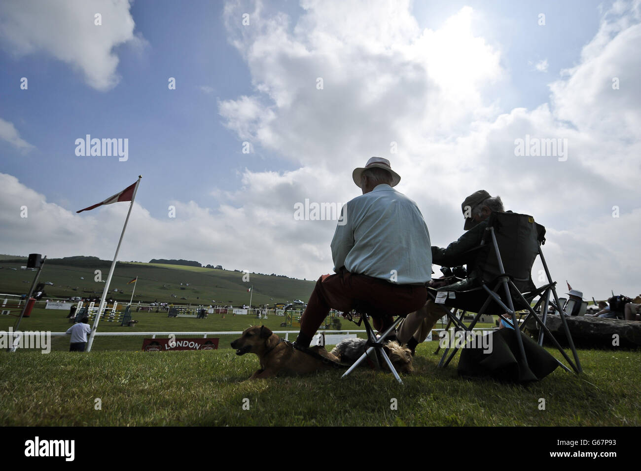 People relax in the hot sunshine during day three of the Barbury International Horse Trials at Barbury Castle, Wiltshire. Stock Photo