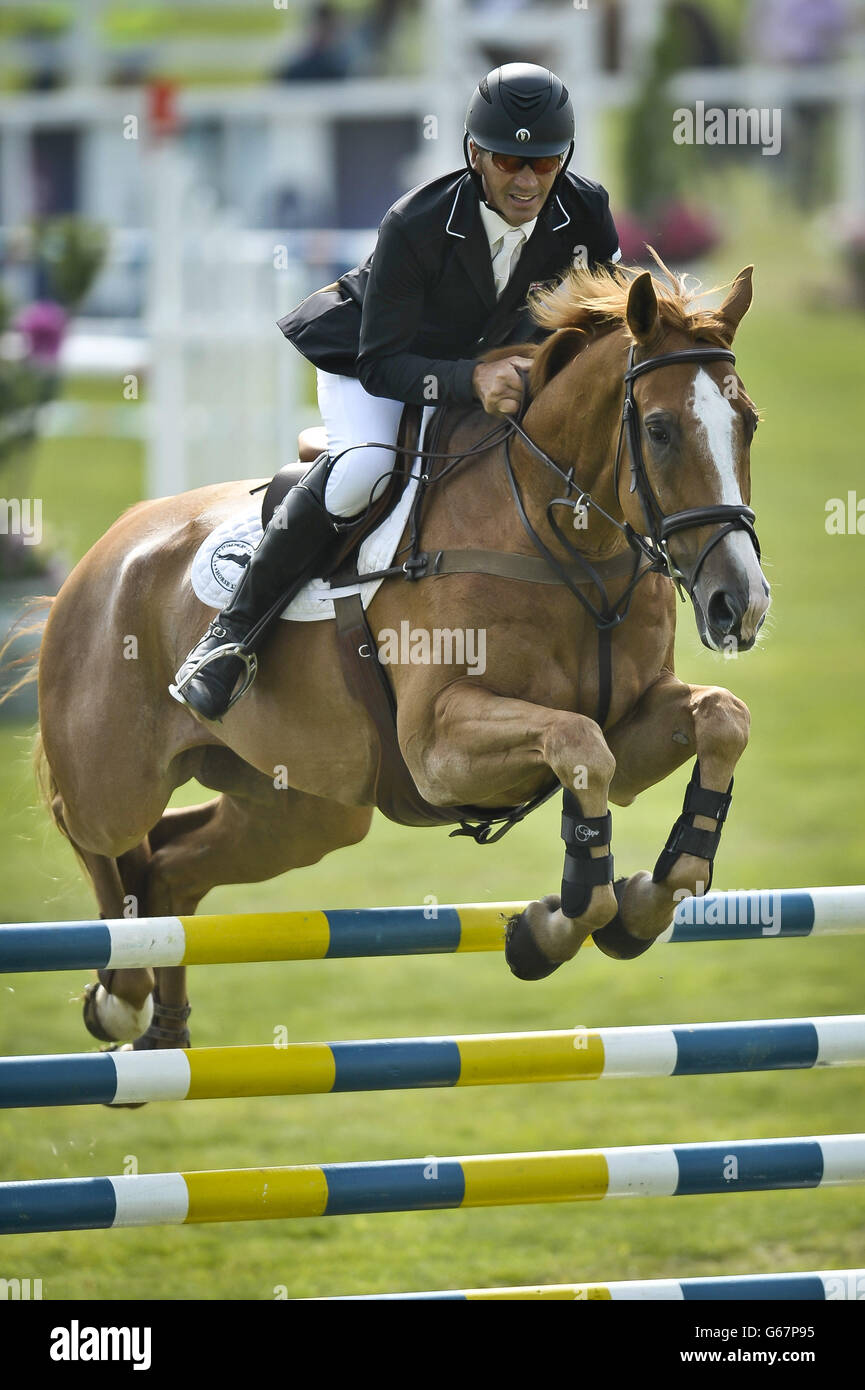 New Zealand's Andrew Nicholson on NEREO takes part in the Showjumping during day three of the Barbury International Horse Trials at Barbury Castle, Wiltshire. Stock Photo