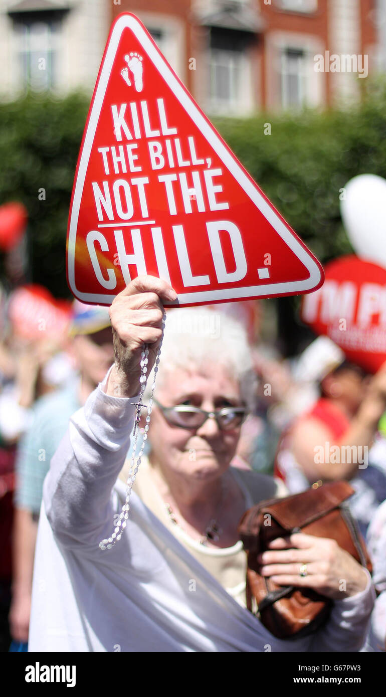 A Pro Life demonstrator holds Catholic Rosery beads as she joins protestors on O'Connell Street, Dublin, ahead of next weeks Abortion Legislation vote in Leinster House. Stock Photo