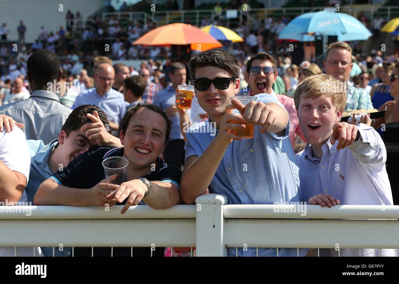 Spectators At The Races Horse Racing - Coral-Eclipse Day - Sandown Park. Spectators enjoy their ...