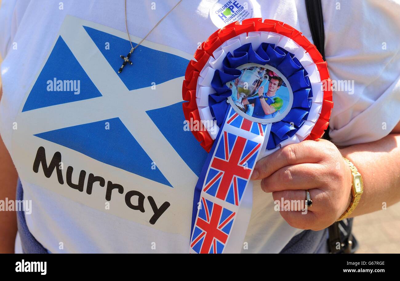 An Andy Murray fan arrives on Murray Mount during day thirteen of the Wimbledon Championships at The All England Lawn Tennis and Croquet Club, Wimbledon. Stock Photo