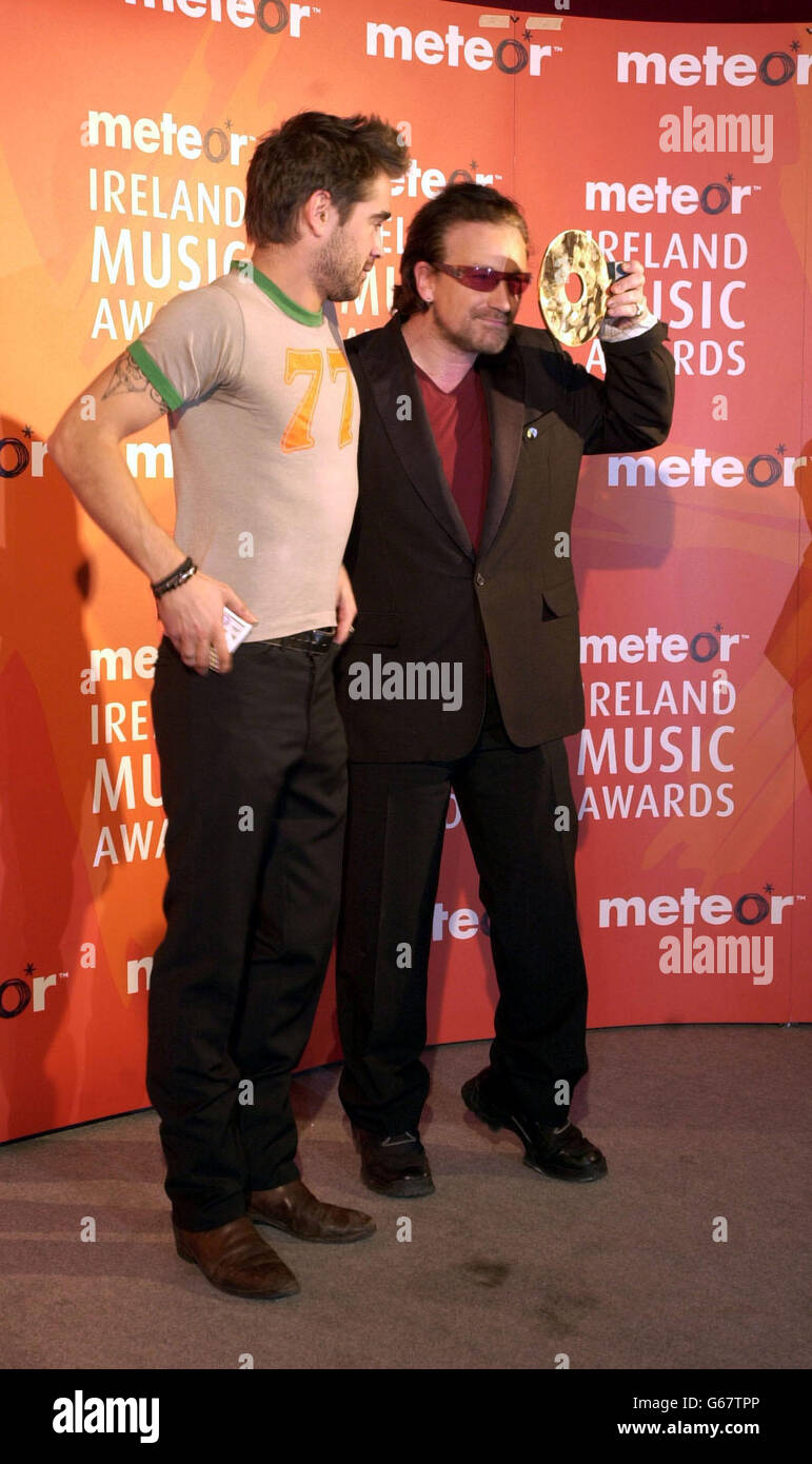 Dublin born Hollywood actor Colin Farrell (left) after presenting U2 frontman Bono the Humanitarian Award for his work in Africa and other Third World countries during the Meteor Ireland Music Awards at the Point Theatre in Dublin, Republic of Ireland. Stock Photo