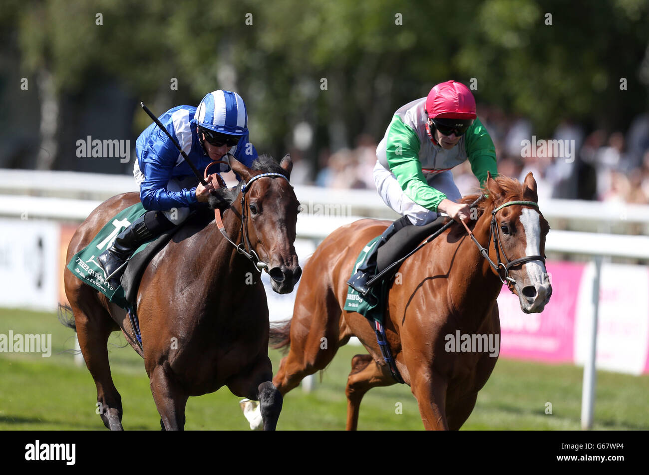 Qawaasem ridden by Paul Hanagan (left) beats Valonia ridden by Fergus Sweeney (right) to win the Three Chimneys E.B.F. Maiden Fillies Stakes during Boylesport Ladies Day of the Piper-Heidsieck July Festival at Newmarket Racecourse, Newmarket. Stock Photo