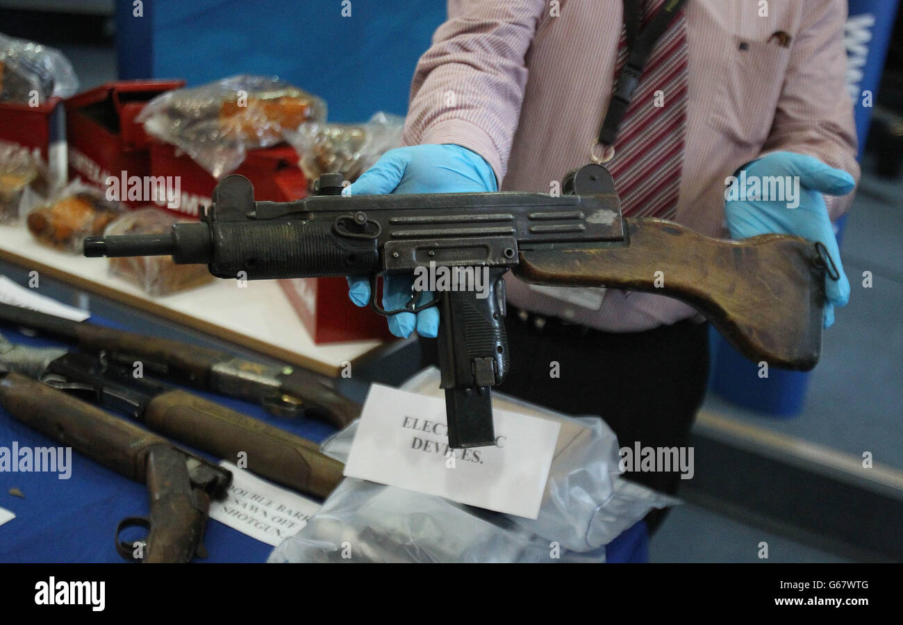 Gardai display arms and explosives, including an Uzi Submachine gun