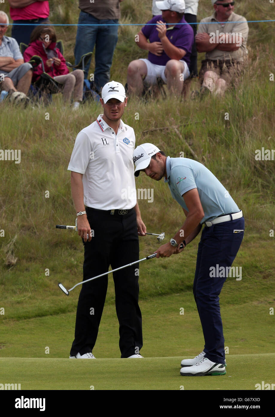 Simon Thornton plays as Chris Wood looks on at the 14th during day one ...