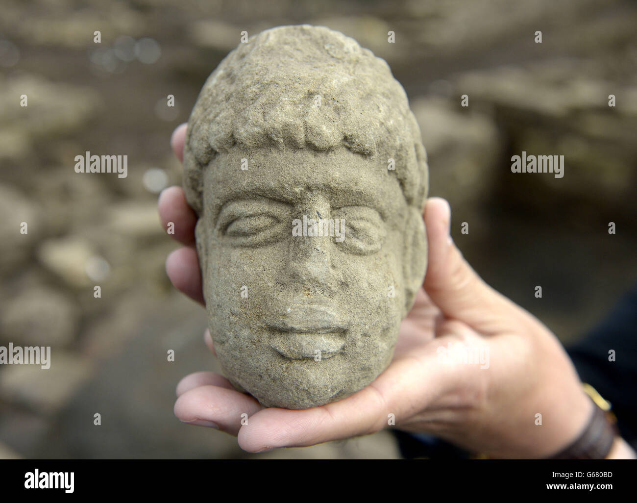 The 1,800-year-old carved stone head of a possible Geordie Roman god that was found by archeologists from Durham University at Binchester Roman Fort, near Bishop Auckland in County Durham. Stock Photo