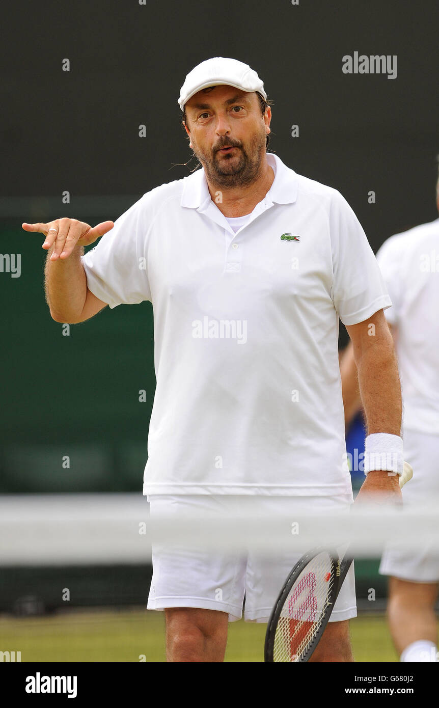 France's Henri Leconte in his Senior Gentleman's Invitational Doubles match  with Iran's Mansour Bahrami against USA's John McEnroe and Patrick McEnroe  during day nine of the Wimbledon Championships at The All England