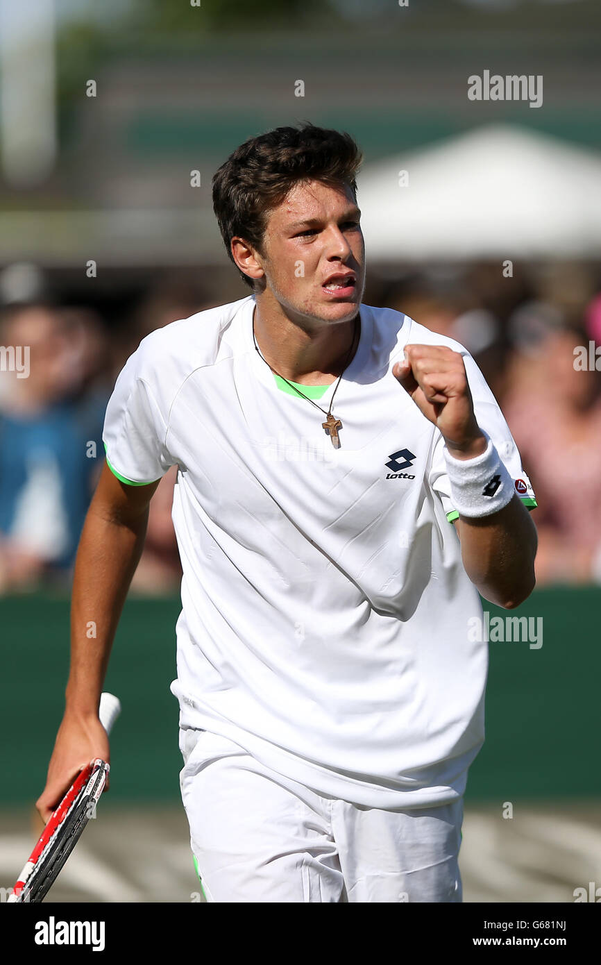 Italy's Gianluigi Quinzi celebrates against Great Britain's Samm Butler in  the Boy's Single's during day six of the Wimbledon Championships at The All  England Lawn Tennis and Croquet Club, Wimbledon Stock Photo -