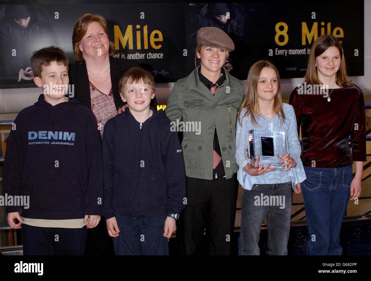 Edith Bowman, poses with (from left) Joseph Ling, William Harman, Dominique Bearfield - Vine, and Abigail Carter and their teacher Rebecca Ward, Kings Heath Junior School, Birmingham, * ... after they were presented with the Insight Award for Film 'Who Do You Think I am? during the First Light Film Awards, at the Odeon Leicester Square. Stock Photo