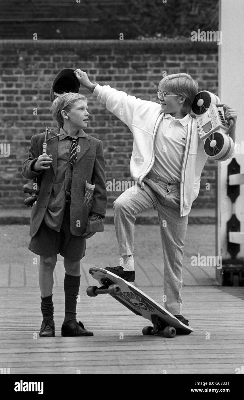 Schoolboy David King (right) as a contemporary version of Nestle's 'Milky Bar Kid', takes the cap from his brother Stephen, dressed as the 1937 version. Stock Photo