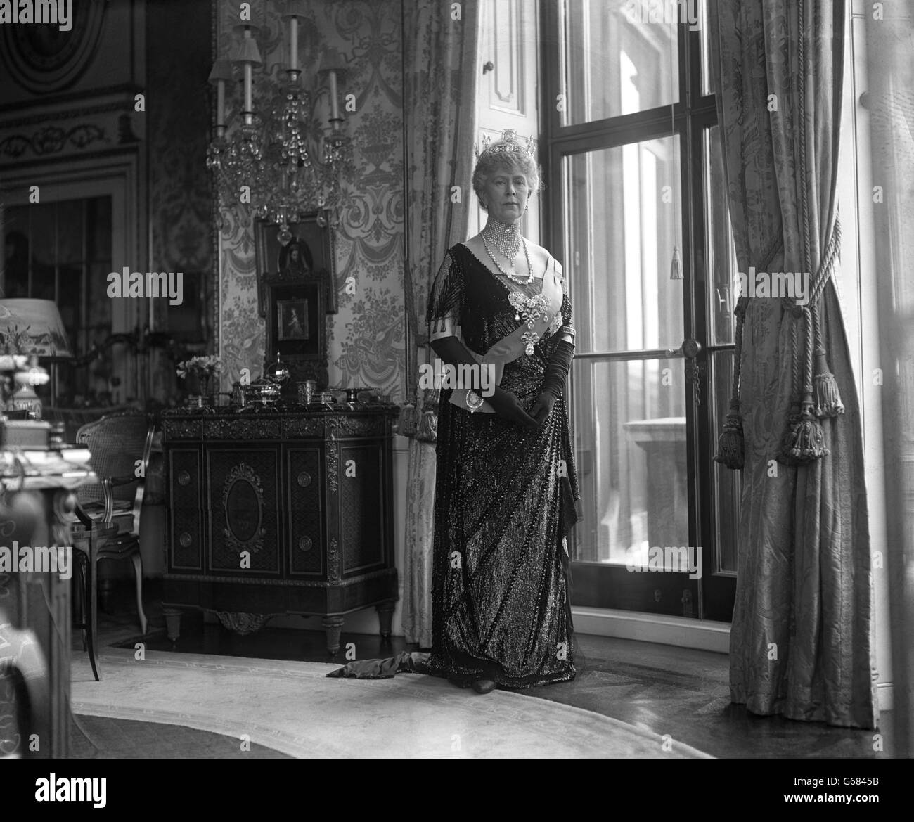 Queen Mary in her dress worn for the opening of Parliament. Stock Photo