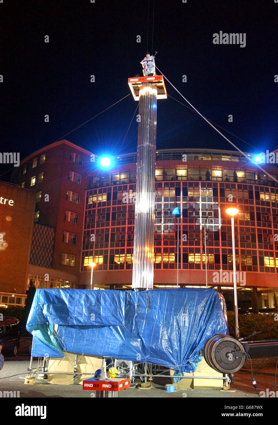 Comedian Jack Dee on top of a 50 foot pole where he will try to remain