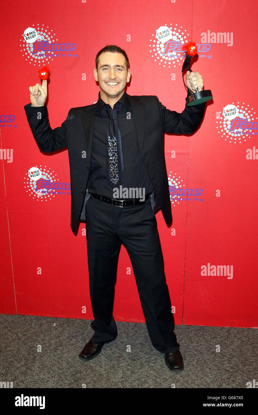 Actor Will Mellor poses for photographers after winning during the