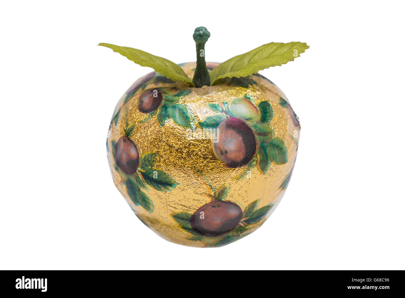 Artificial apple made of wood with gold paper and pattern Stock Photo