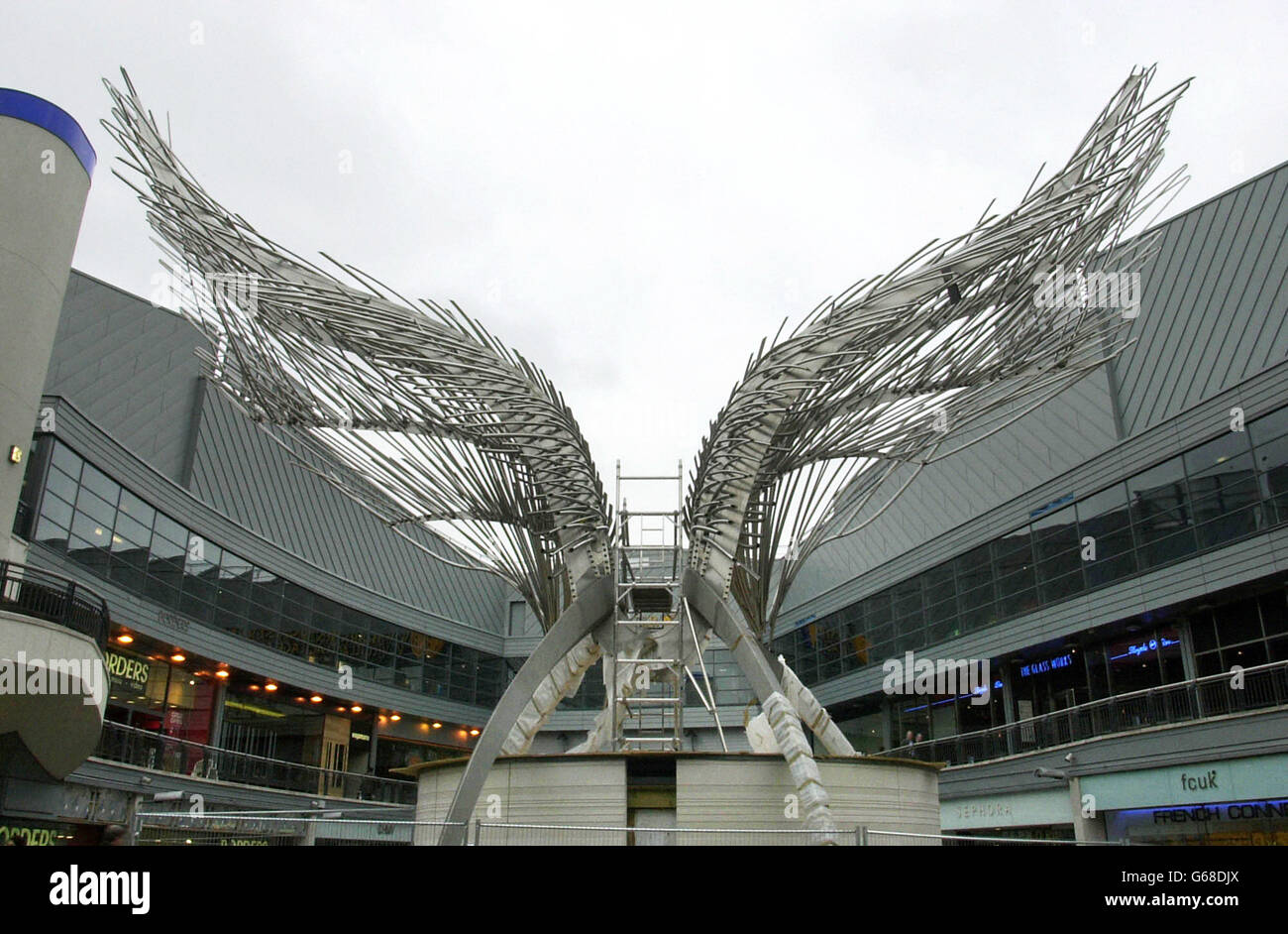 A sculpture labelled the 'Angel of Islington' waits to be unveiled in a shopping centre in Islington, north London. The 52ft high model was designed by sculptor Wolfgang Butress, who won a competition to design the piece and will tower over the central park. Stock Photo