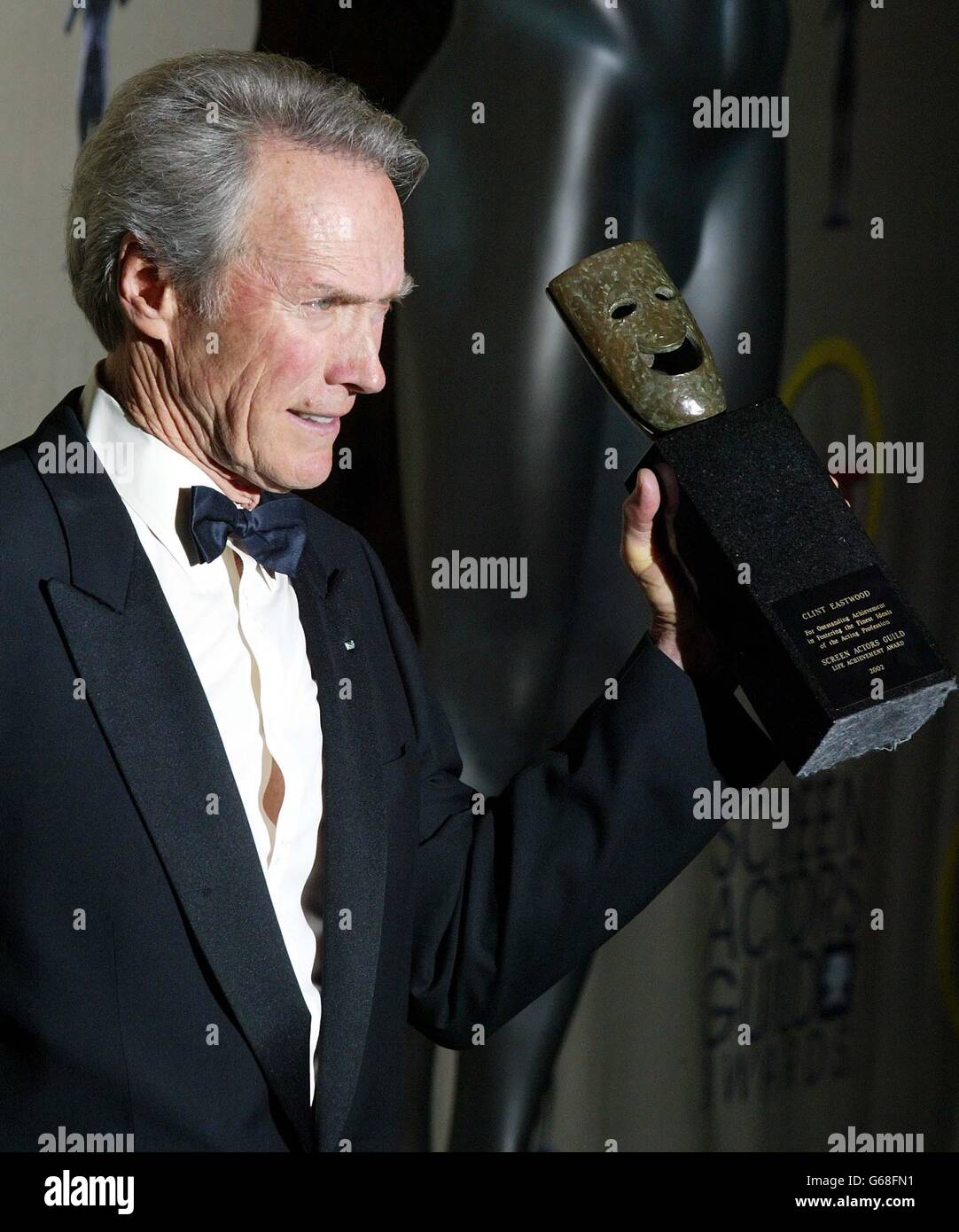 Actor Clint Eastwood poses for photos with his Screen Actors Guild (SAG) Life Achievemnt Award at the 9th annual Screen Actors Guild Awards at the Shrine Auditorium in Los Angeles. Stock Photo