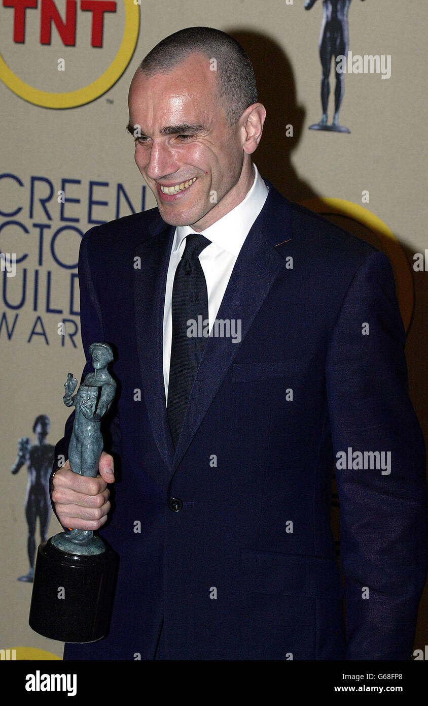 Actor Daniel Day-Lewis poses for photos with his Screen Actors Guild (SAG) awards at the 9th annual Screen Actors Guild Awards at the Shrine Auditorium in Los Angeles. Day Lewis won outstanding performance by a male actor in a leading role for his role in Gangs of New York. Stock Photo