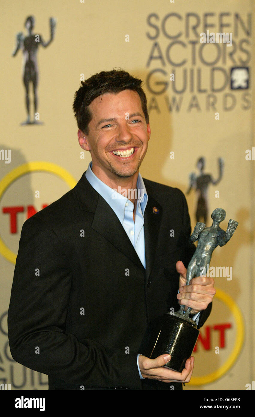 Actor Sean Hayes poses for photos with his Screen Actors Guild (SAG) award for outstanding performance by a male actor in a comedy series for his role on Will and Grace at the 9th annual Screen Actors Guild Awards at the Shrine Auditorium in Los Angeles. Stock Photo