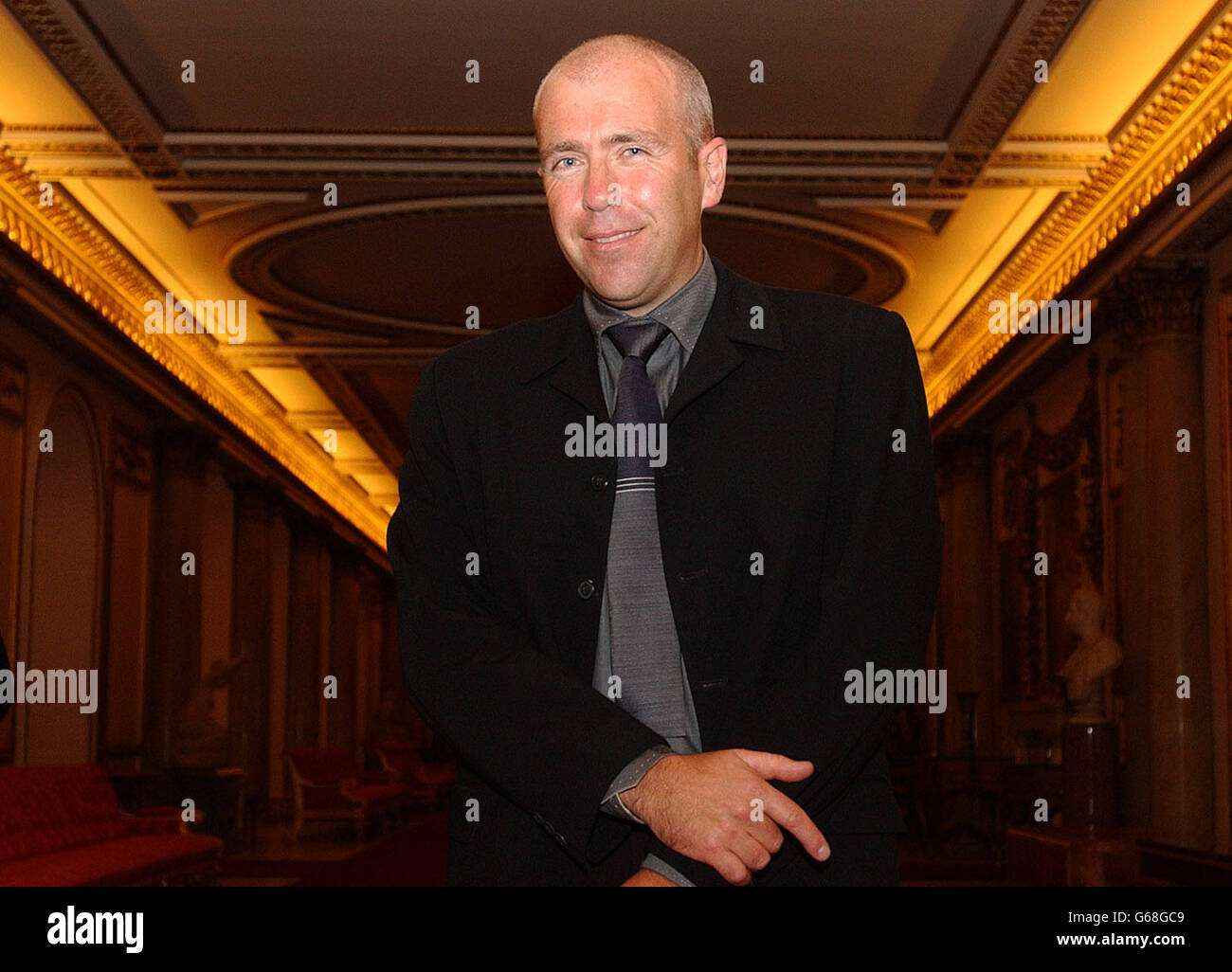 Richard Flanagan, winner of the 2002 Commonwealth Writers Prize at Buckingham Palace, London, where he was being received by Britain's Queen Elizabeth II. Stock Photo