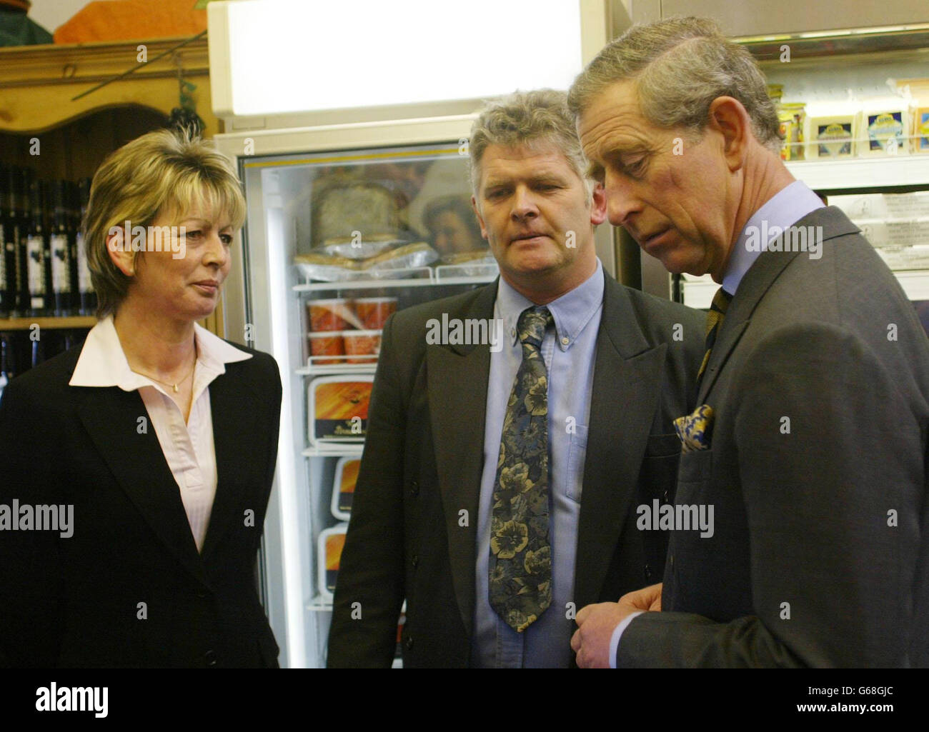 The Prince of Wales speaks to Lynda and Frank Morphet at the Plumgarths Lakelands Food Park near Kendal, during a day long visit to Cumbria. Tasting local products he sipped some damson gin and said: 'This will keep the cold out when shooting.' Stock Photo