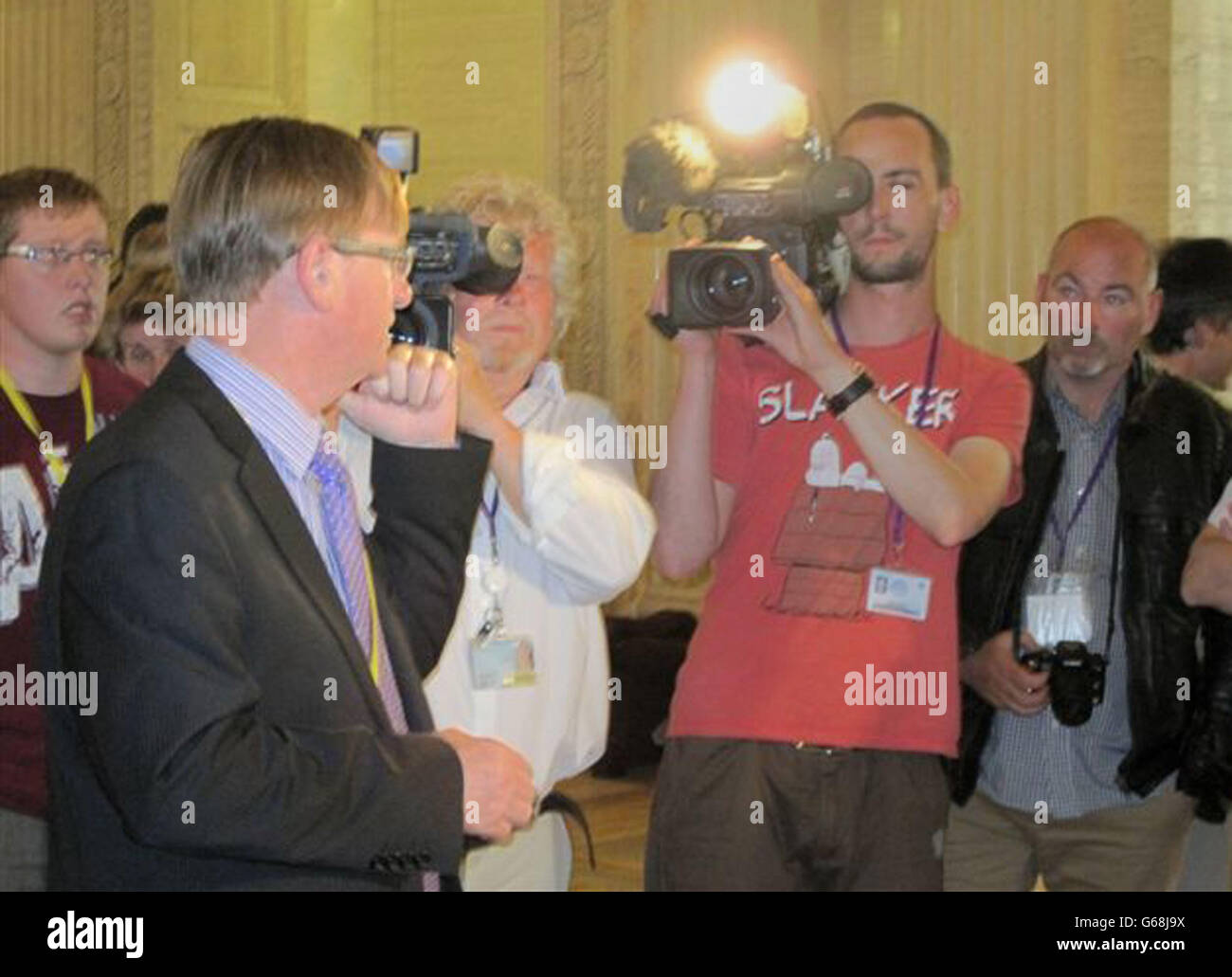 Prominent loyalist flag protester Willie Frazer (2nd left) at the Stormont Assembly in Belfast, shortly before he was arrested by the PSNI for breach of bail conditions. Stock Photo