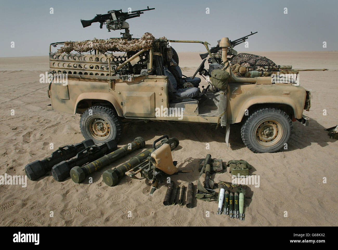 A Weapons Mounted Insatllation Kit sit in the Kuwait desert as members of a Brigade Patrol Troop, part of the Brigade Recce Force, who are an elite team within the Marine Commando Brigade, prepare for possible miltary action. * These specially adapted Land Rovers (Weapons Mounted Installation Kit) enable the troop to tackle some of the most difficult terrain. They are led by Sgt. Joe Gillespie. Stock Photo