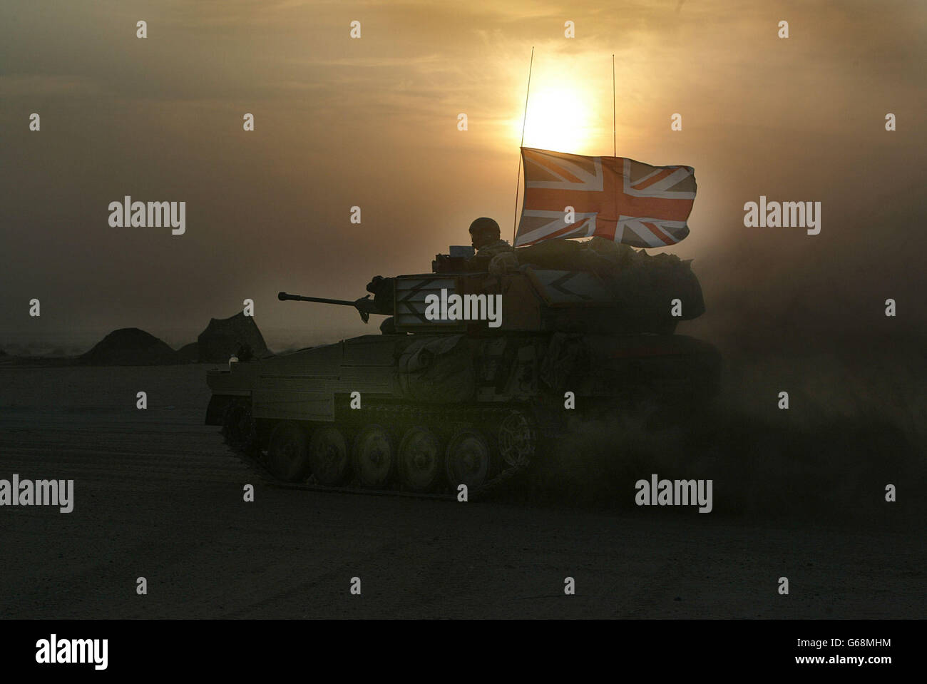 Image released British Forces in Kuwait, of the 'Scimitar' light armoured vehicles from the Queen's Dragoon Guards taking up final positions in the northern Kuwaiti desert. Stock Photo