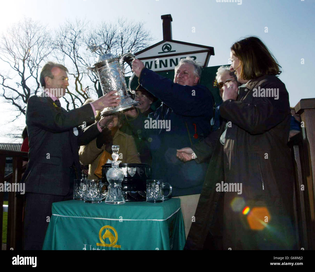 Mr. Norman Moore with the owners trophy at the John Smiths Midland Grand National at Uttoxeter Race Course, Uttoxeter. Stock Photo