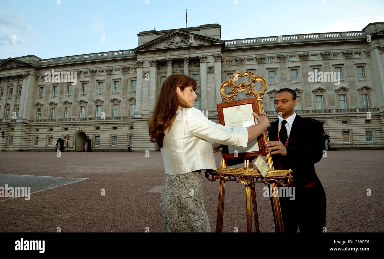 The Queen's Press Secretary Ailsa Anderson with Badar Azim a footman(00)