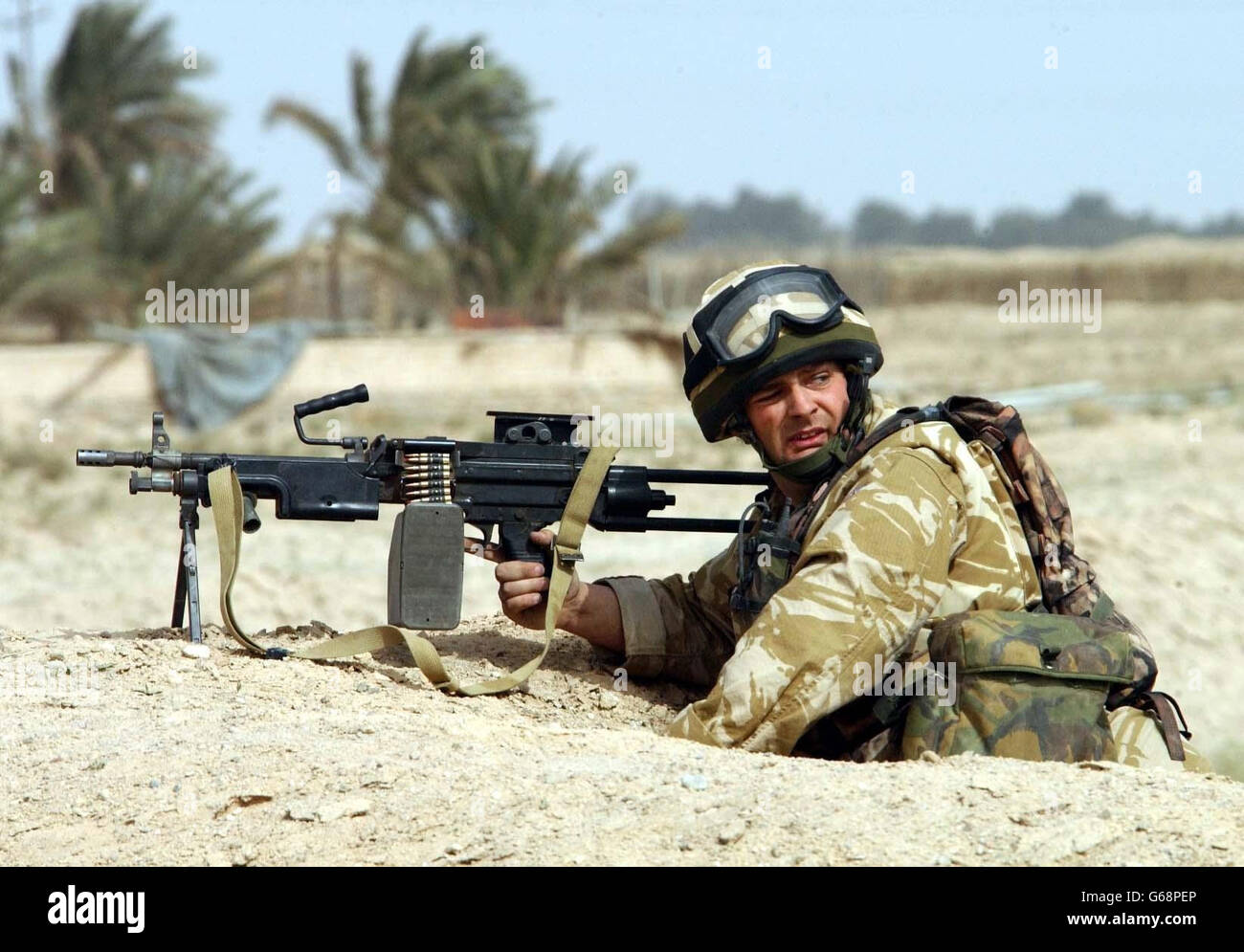 A member of the Light Infantry operating alongside the British 2nd Royal Tank Regiment secures a position near Basra. Stock Photo