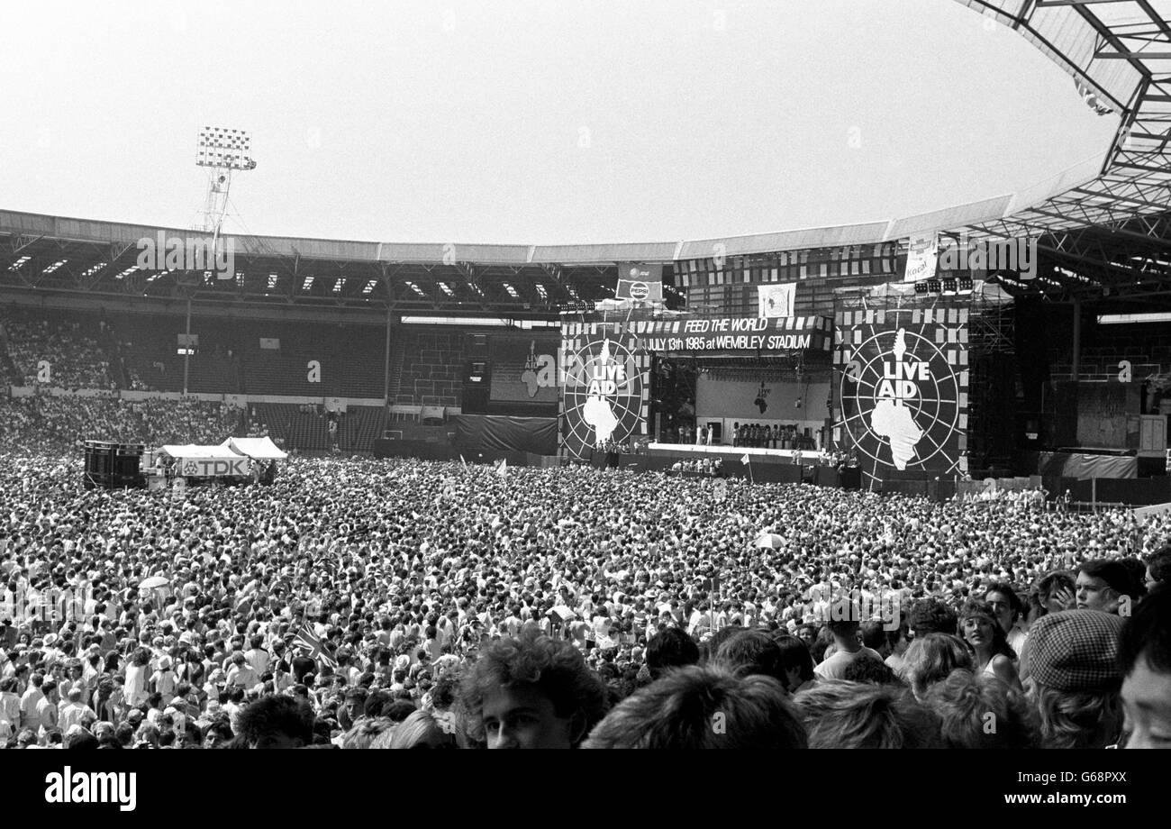 A general view of Wembley stadium with the guards band playing the National Anthem on the arrival of the Prince and Princess of Wales who opened the Live Aid concert. Stock Photo