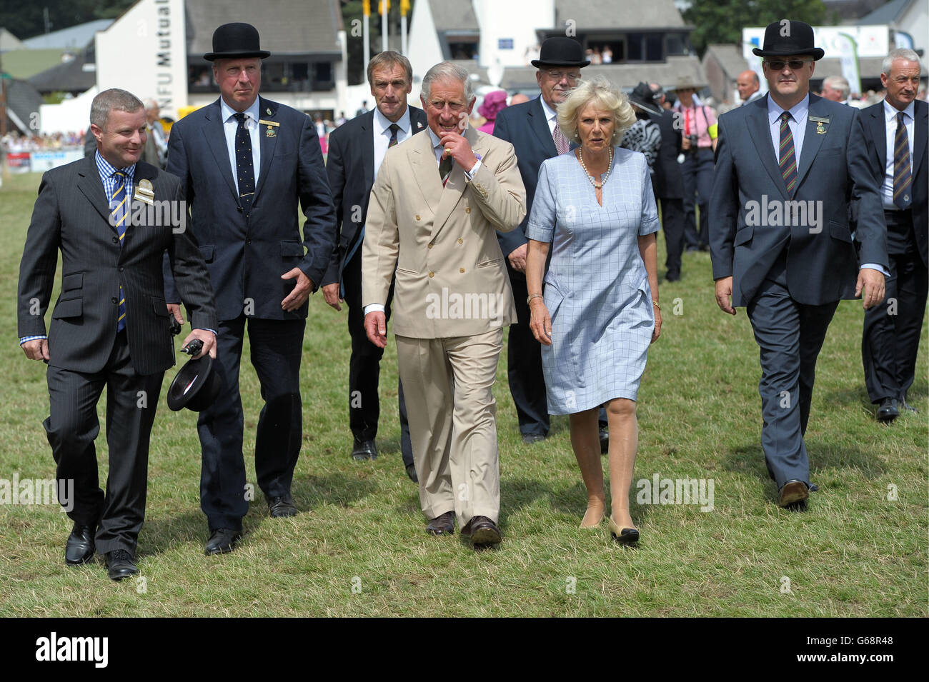 The Prince of Wales and the Duchess of Cornwall in the Main Ring at the Royal Welsh Show in Llanelwedd, Builth Wells. Stock Photo