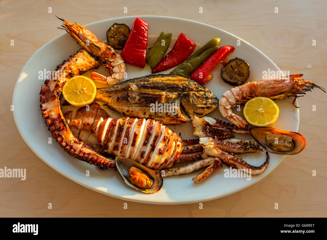 Large platter of fried seafood and vegetables Stock Photo