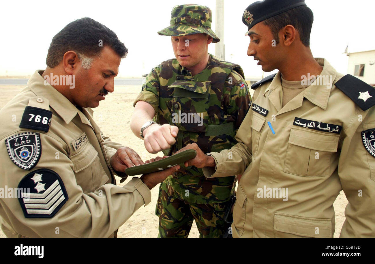 3 battalion reme's Sgt. Gary Evans from Hull shows Kuwait police ...