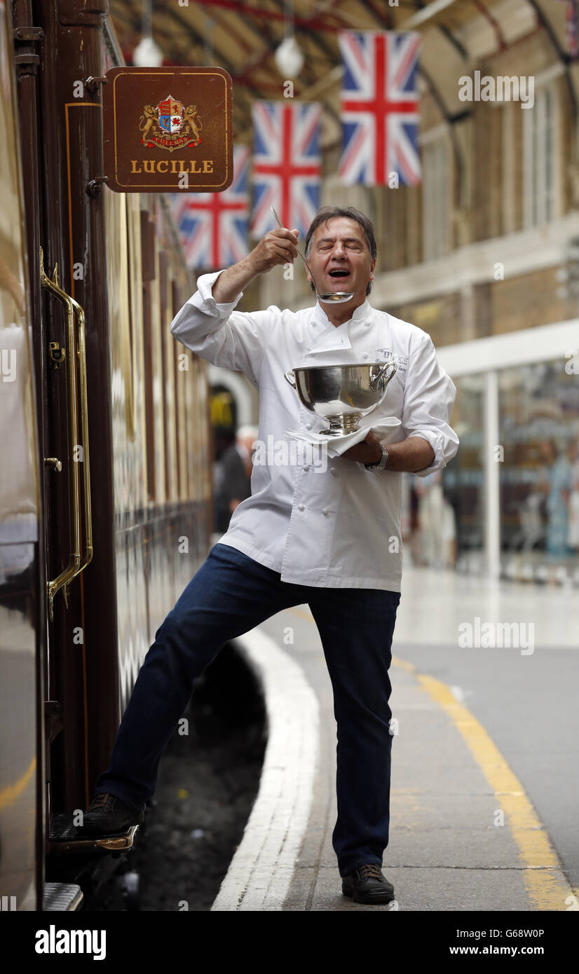 Michelin starred chef Raymond Blanc attends a photocall beside the British Pullman, sister train to the Venice Simplon-Orient-Express, at London Victoria Station to promote a series of 'pop-up' dinners to be hosted by renowned chefs on the train during 2013 and 2014. Stock Photo