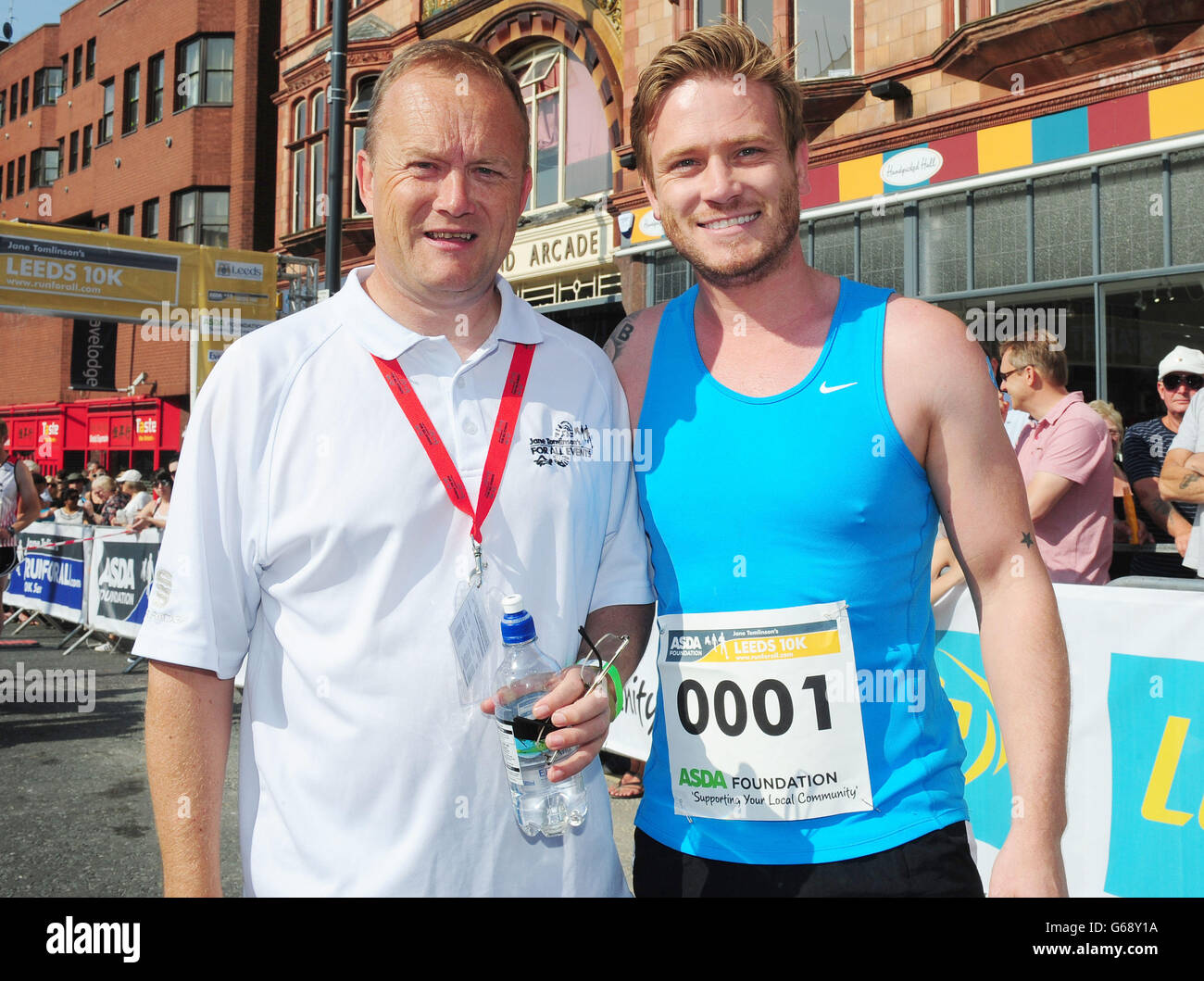 Mike Tomlinson (left) husband of the late Jane Tomlinson, with Emmerdale actor Matthew Wolfenden, ahead of the Leeds 10k run. Stock Photo