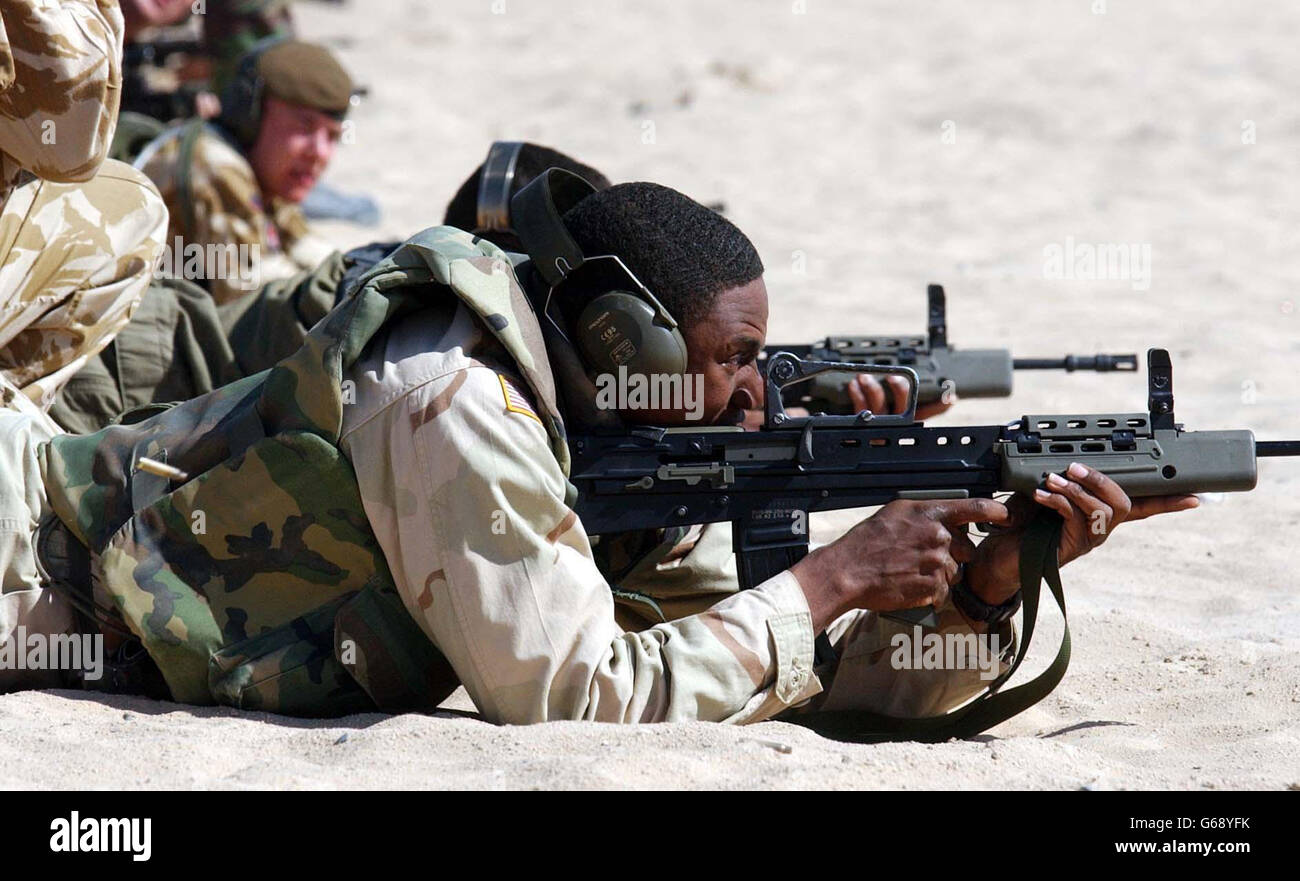Soldiers in Kuwait gun training. Staff Sergeant Jabari Williams takes