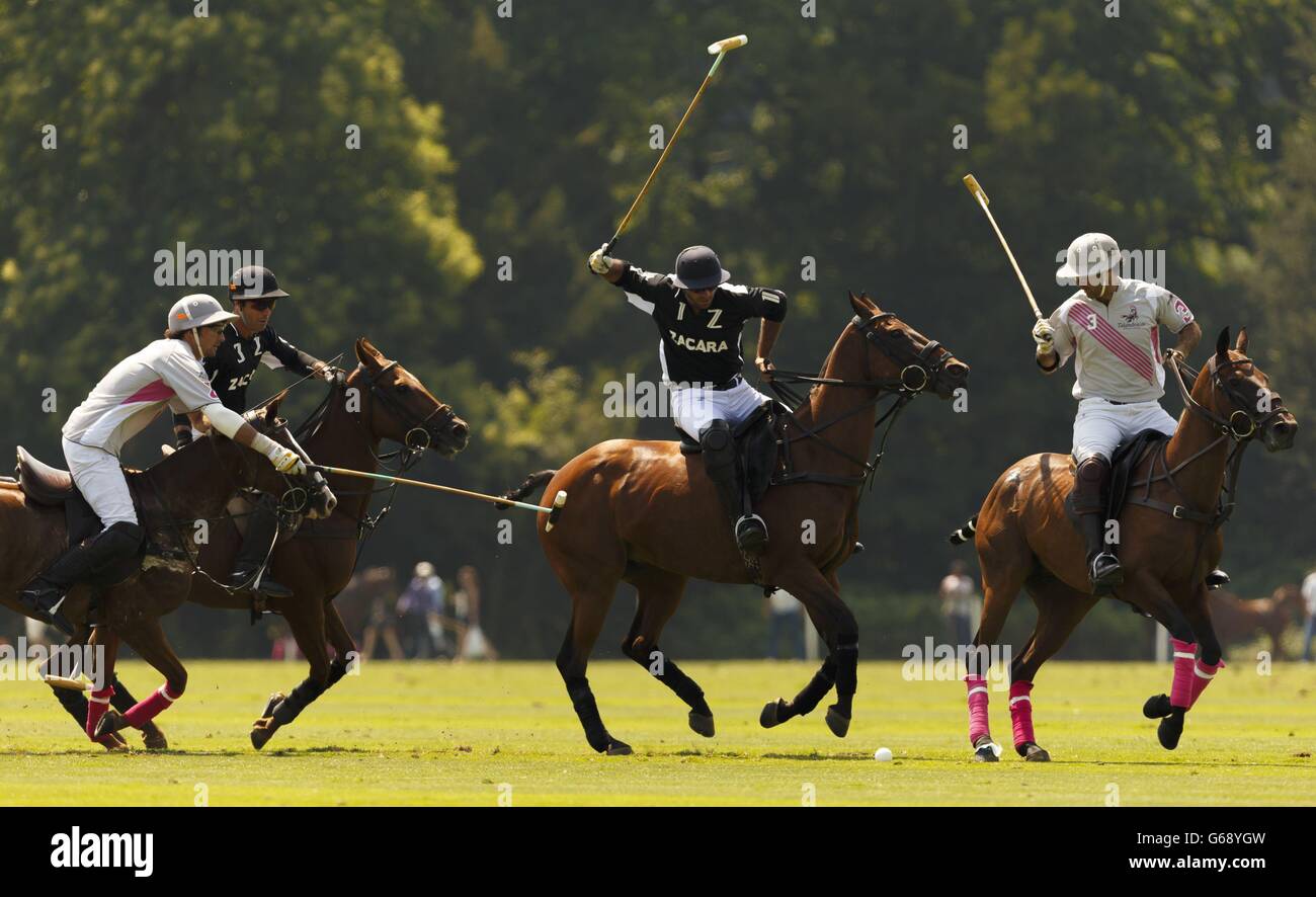 Facundo Pieres of Zacara (second from right) takes aim during their semi-final of the Veuve Clicquot Polo Gold Cup at Cowdray Park in Midhurst, West Sussex. Stock Photo