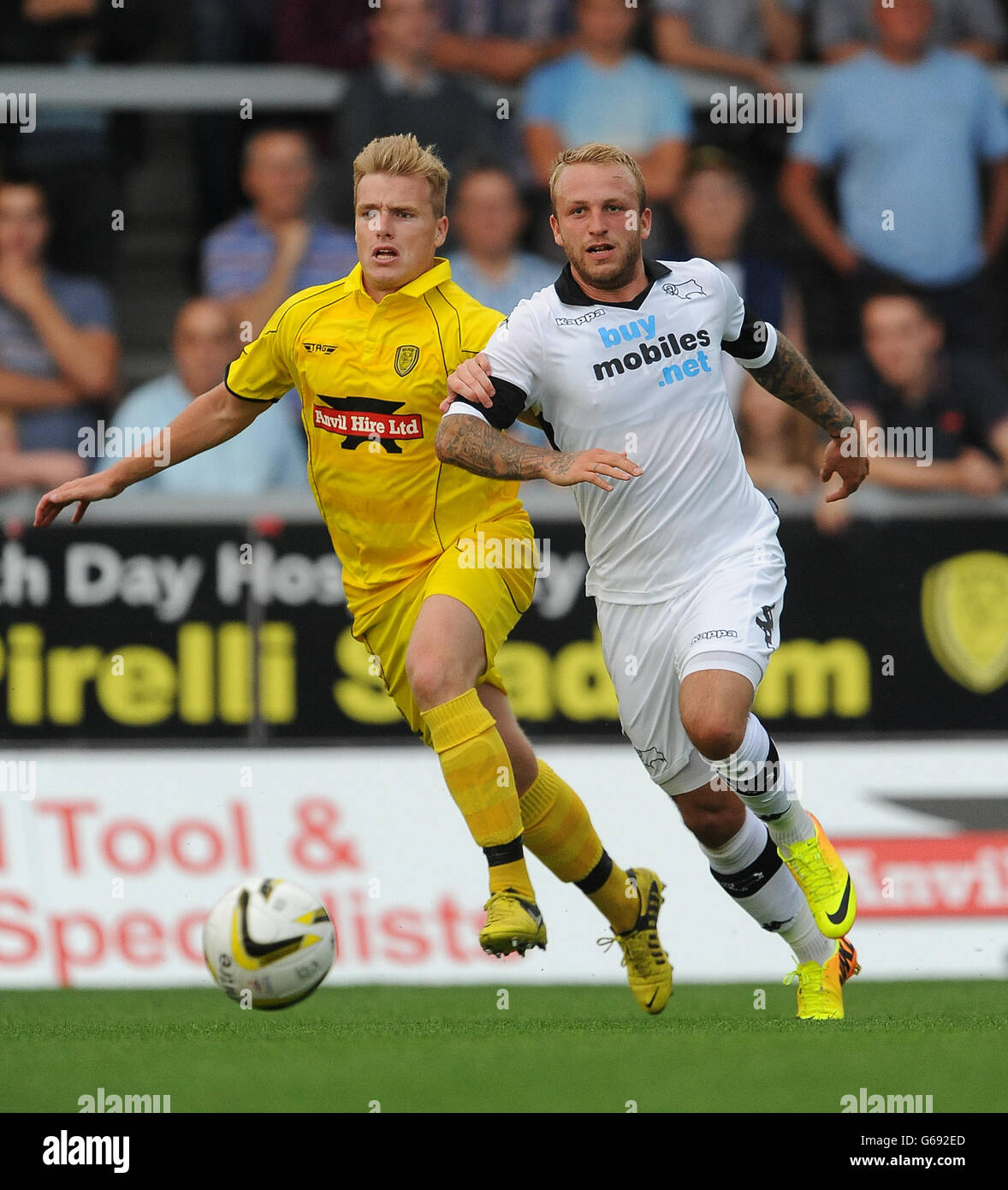 Burton Albion's Damien McCrory (left) and Derby County's Johnny Russell  (right) battle for the ball Stock Photo - Alamy