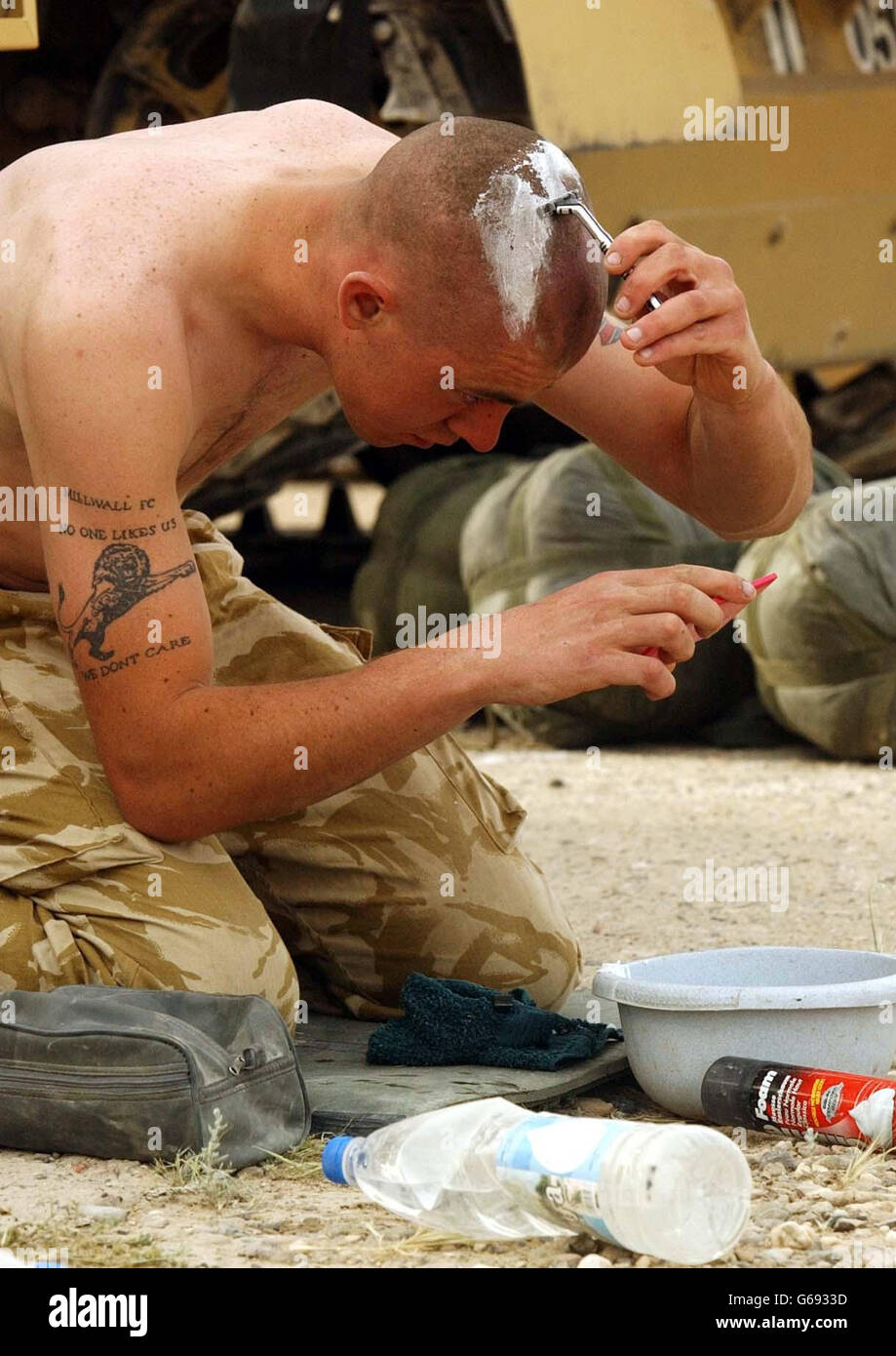 A Royal Scots Dragoon Guard takes a break after a long night of fighting in Southern Iraq. Stock Photo