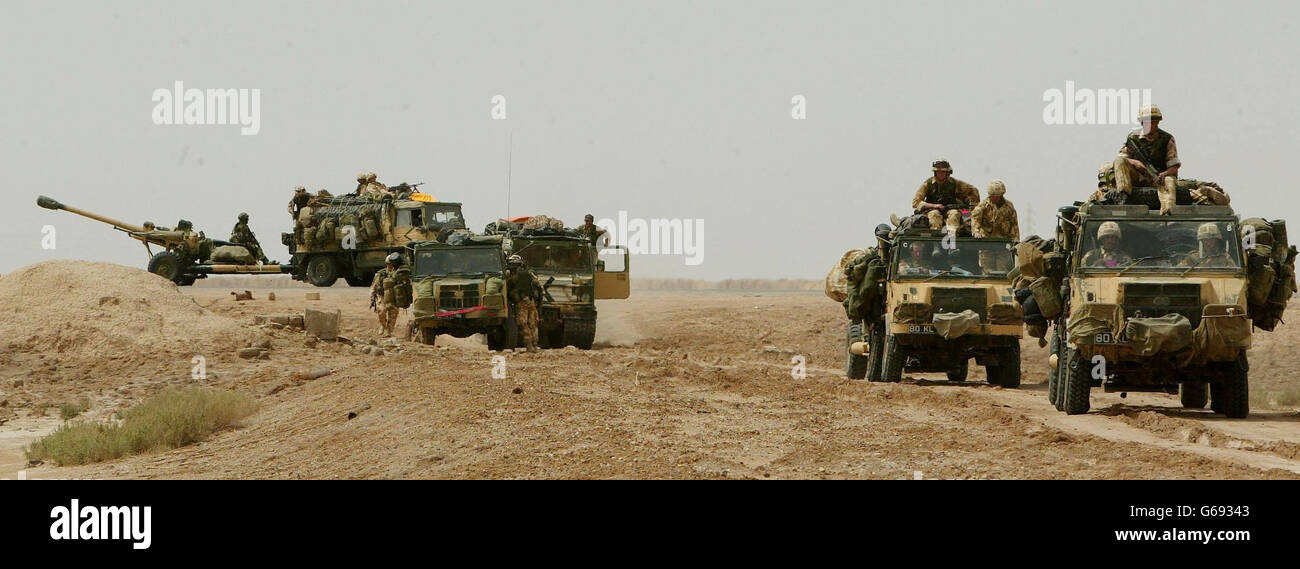 British soldiers from 29 Commando Regiment Royal Artillery move into a firing position with their 105mm guns as they push north through southern Iraq. * British forces scoured the Iraqi desert for two missing soldiers on Monday but said the U.S.-led war could weather setbacks hitting both the air and ground campaign. Stock Photo