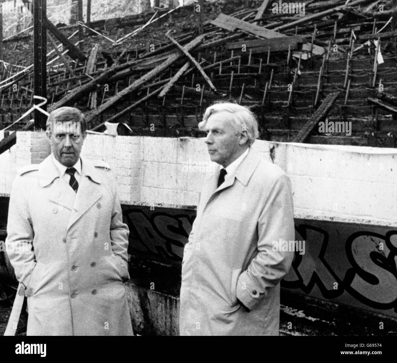 Bradford City FC chairman Stafford Heginbotham (left) with Mr Justice Popplewell, in front of the stand which was burnt at Bradford's Valley Parade ground. The 57-year old judge spent more than half-an-hour touring the ground. He is heading the inquiry into the blaze. Stock Photo