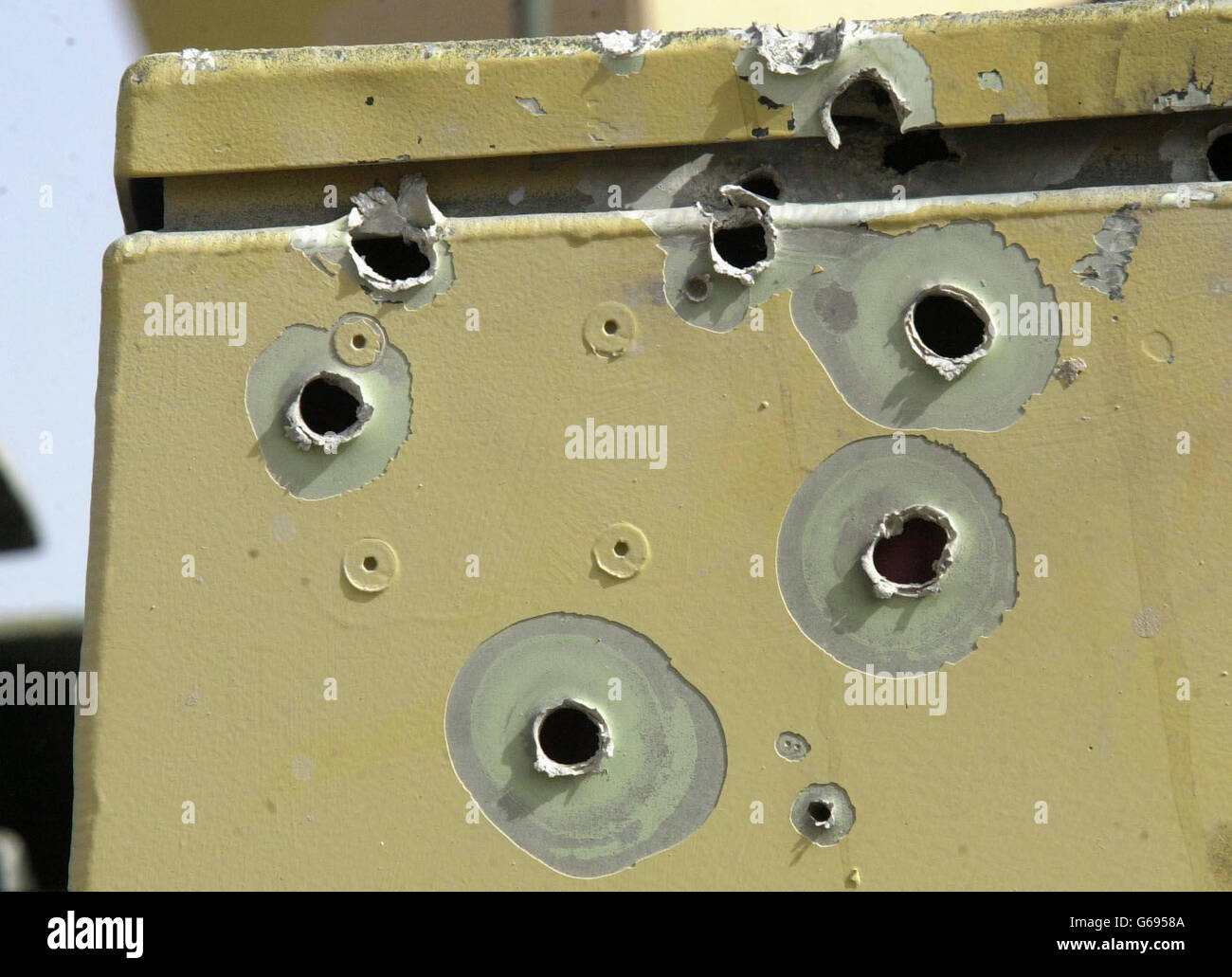 Bullet holes in a British Army Challenger 2 tank from C Squadron of the Royal Scots Dragoon Guards battle group which came under fire from rocket propelled grenades and machine gun fire outside Basra. * Its machine gun and main tank gunsight were damaged and the tank commander Sergeant David Baird has described how he witnessed at least four or five children, aged between five and eight, being grabbed by the scruff of the neck and held by Iraqi fighters as they crossed a road in front of his tank. Stock Photo