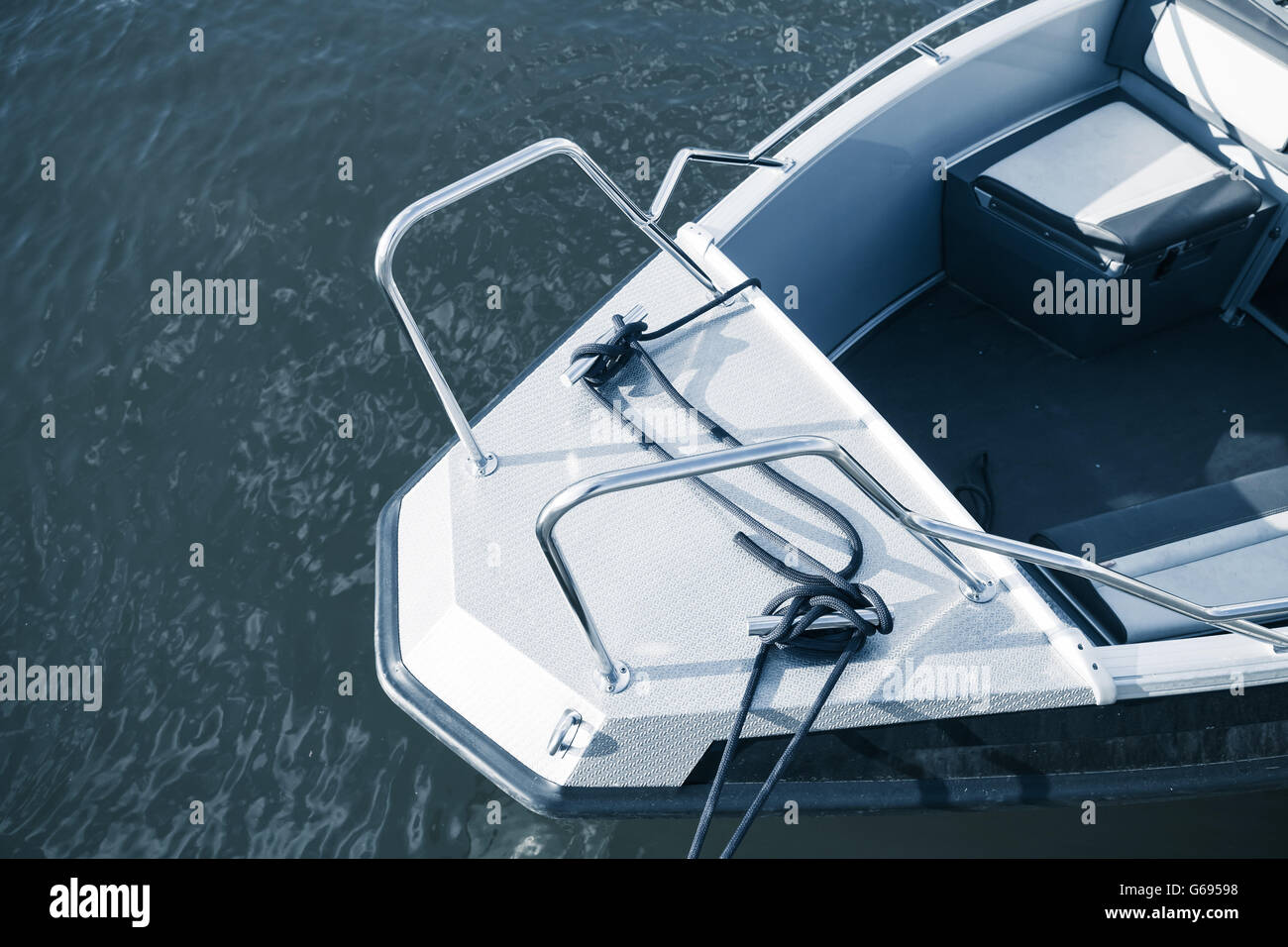 Bow of new metal motorboat, stylized blue toned photo Stock Photo